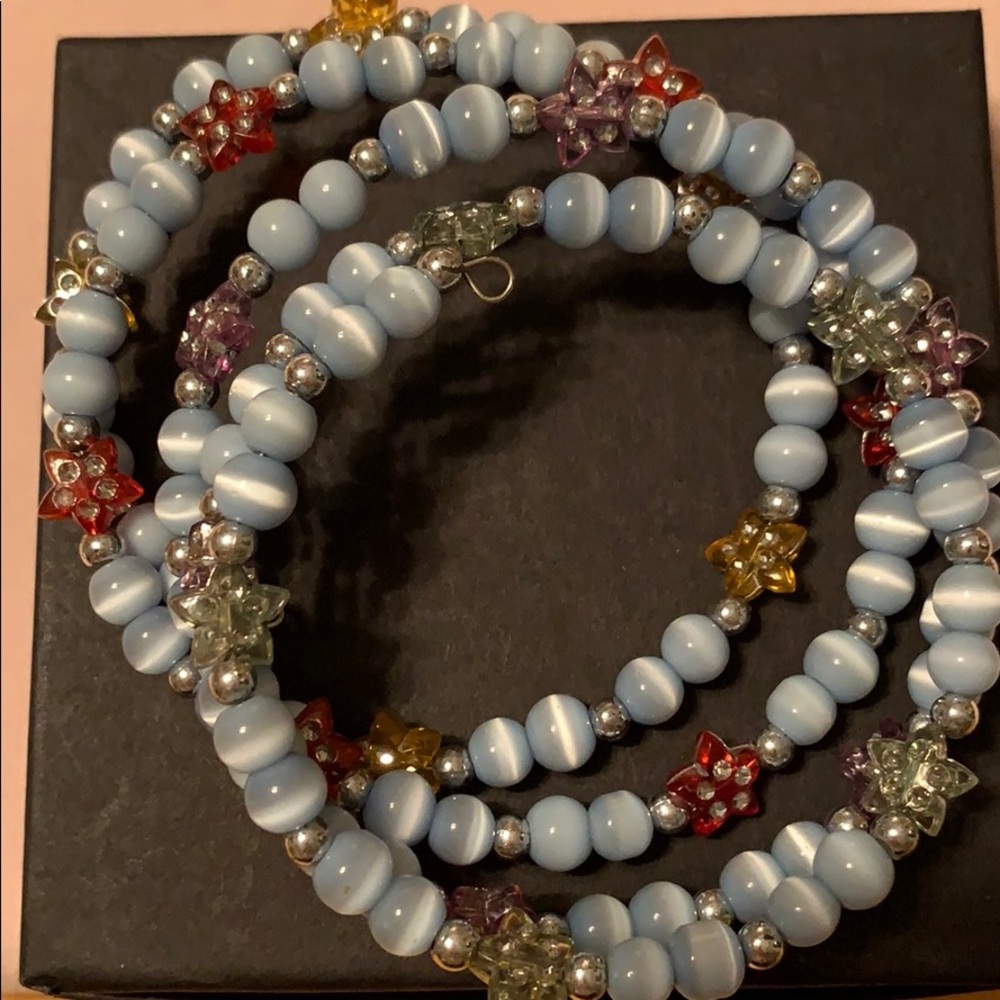 Wrap around blue bead with multi color stars